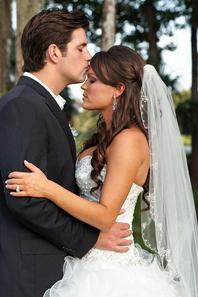 fingertip veil A half-up hairstyle offers the best of both worlds- you get the look of lush and romantic curls. Pair it with a fingertip veil.
