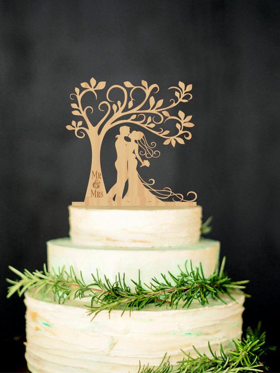 personalize your wedding cake Bride and groom carved wood cake topper will bring you an opportunity to personalize your wedding cake and will help make it unique.