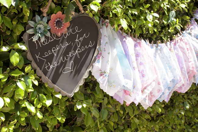 Wedding handkerchiefs hanging from tree at ceremony