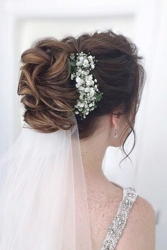 wedding hairstyles for curly hair classy updo bun with veil and flowers julia_alesionok